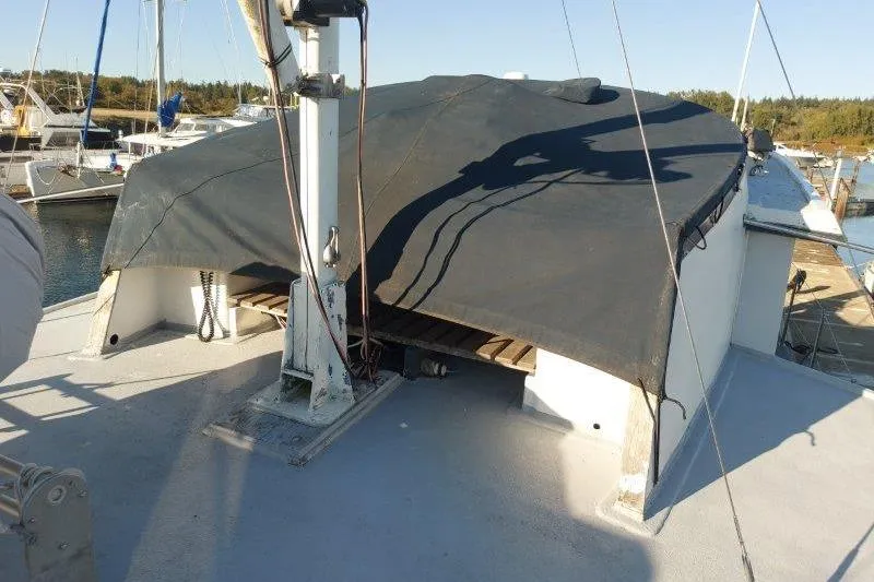 Kallisto Yacht Photos Pics 1982 Kadey-Krogen Krogen 42 Trawler deck with covered hatch in marina setting.