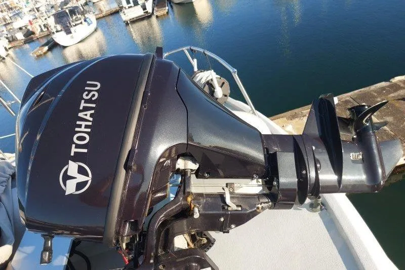 Kallisto Yacht Photos Pics Tohatsu outboard motor on 1982 Kadey-Krogen Krogen 42 Trawler, docked at marina.