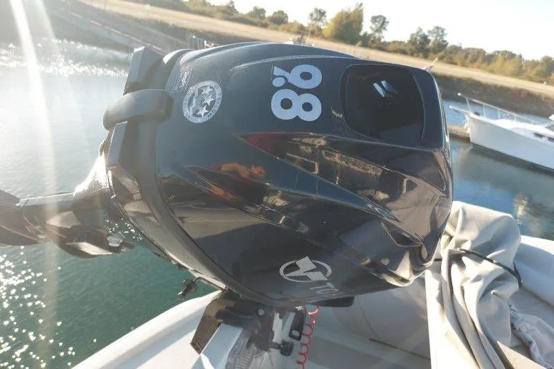 Kallisto Yacht Photos Pics Outboard motor on a boat, sunny day, Kadey-Krogen 1982 Krogen 42 Trawler.