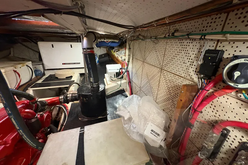 Kallisto Yacht Photos Pics Engine room of a 1982 Kadey-Krogen Pilothouse with visible machinery and wiring.