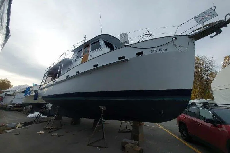 Kallisto Yacht Photos Pics 1982 Kadey-Krogen Pilothouse boat on stands in a boatyard.