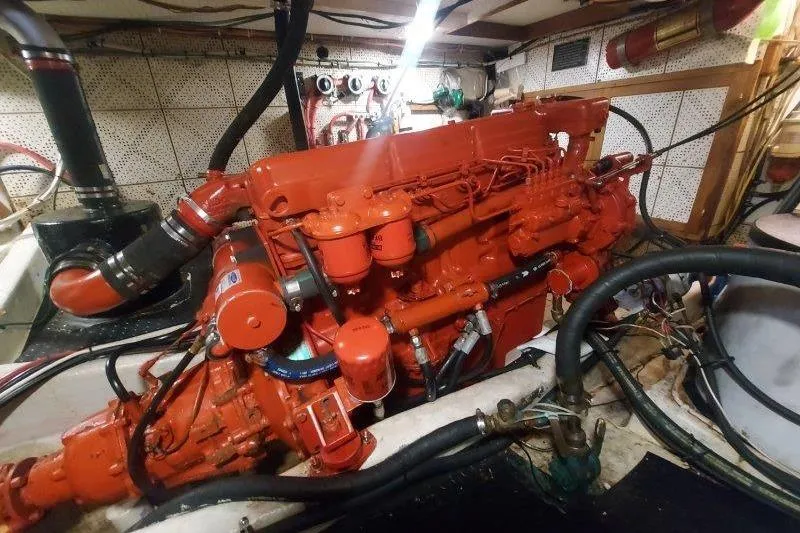 Kallisto Yacht Photos Pics Engine room of a 1982 Kadey-Krogen Pilothouse with a red marine engine.