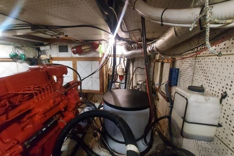 Kallisto Yacht Photos Pics Engine room of a 1982 Kadey-Krogen Pilothouse with visible machinery and piping.