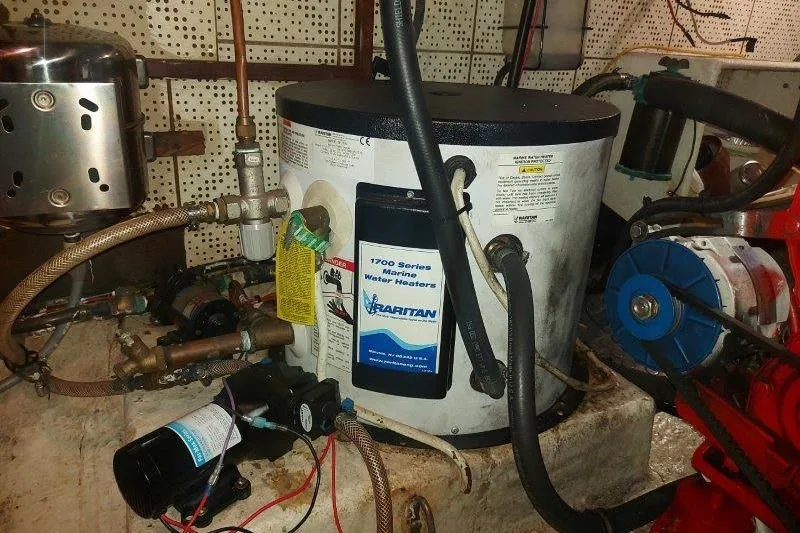 Kallisto Yacht Photos Pics 1982 Kadey-Krogen Pilothouse engine room with Raritan marine water heater.