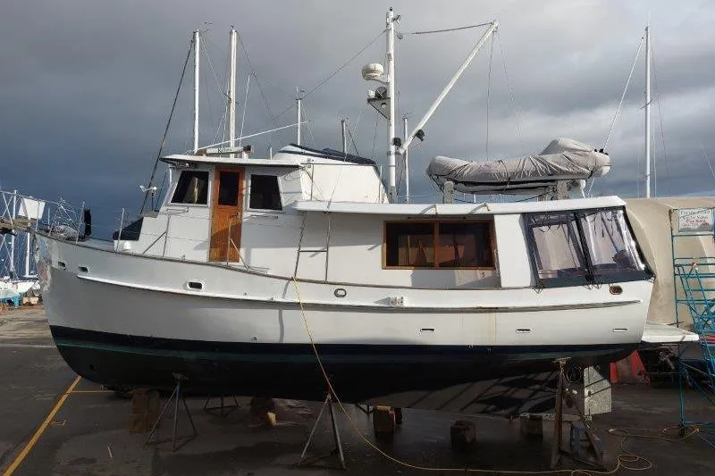 Kallisto Yacht Photos Pics 1982 Kadey-Krogen Pilothouse boat on dry dock, showcasing classic design and sturdy build.