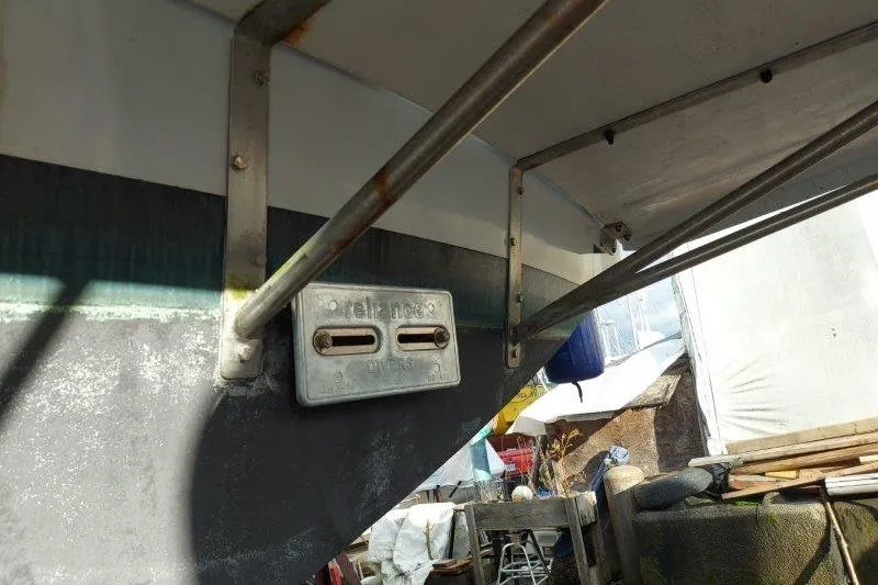 Kallisto Yacht Photos Pics 1982 Kadey-Krogen Pilothouse boat hull with metal fittings and outdoor storage.