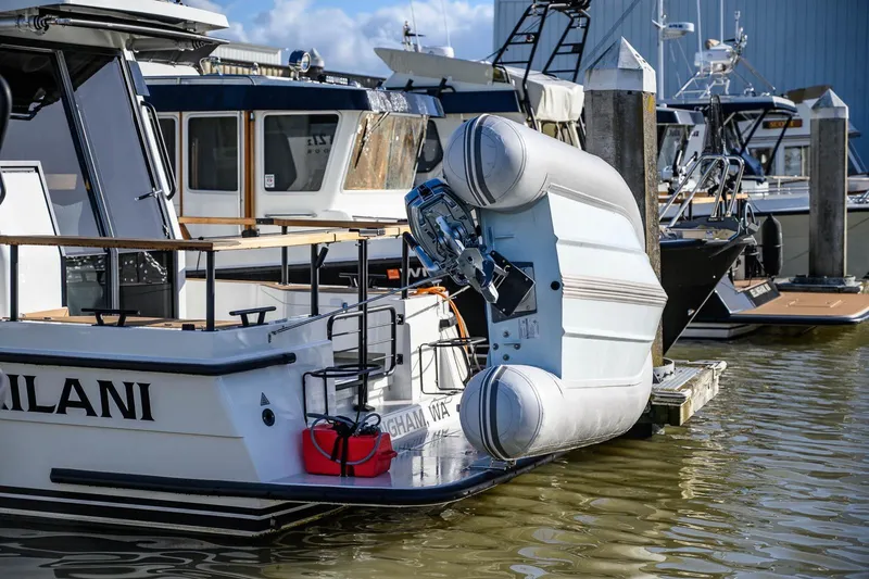  Yacht Photos Pics 2023 Targa 27.2 boat docked with inflatable dinghy attached.