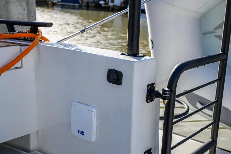  Yacht Photos Pics 2023 Targa 27.2 boat detail with railing and dockside view.