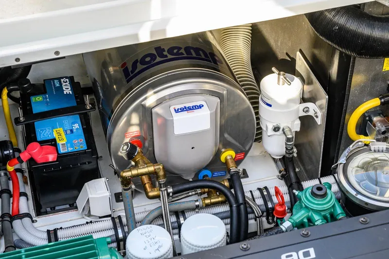  Yacht Photos Pics Engine compartment of 2023 Targa 27.2 boat with Isotemp water heater and Exide battery.