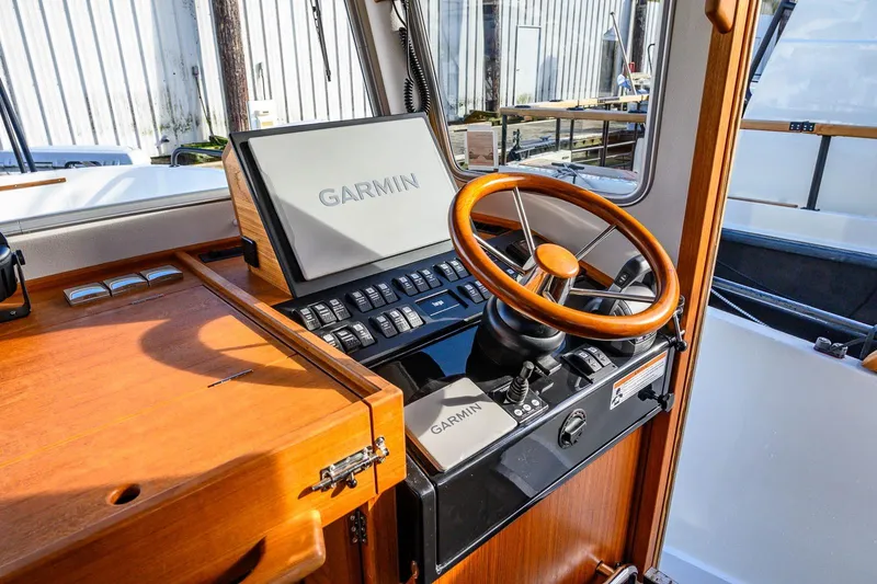  Yacht Photos Pics 2023 Targa 27.2 boat helm with Garmin navigation and wooden steering wheel.