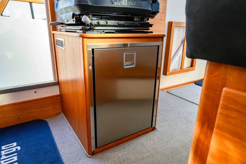  Yacht Photos Pics Interior of 2023 Targa 27.2 boat featuring a compact stainless steel fridge.