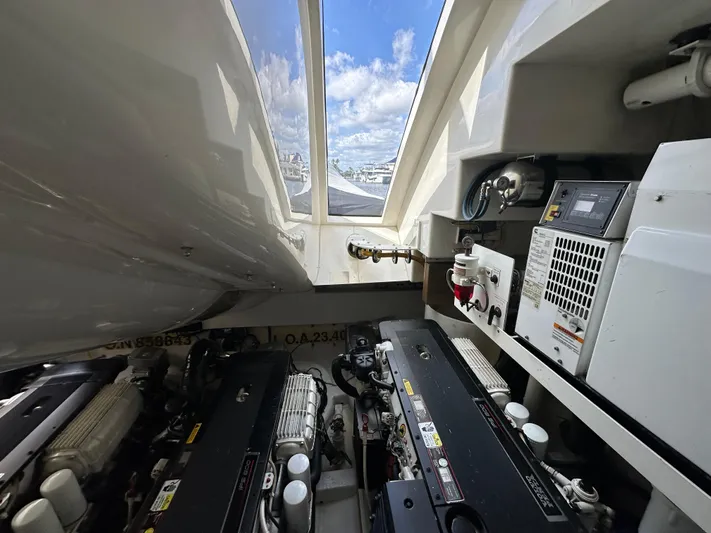 Volk Yacht Photos Pics Engine room of 2009 Lazzara LSX 75 yacht with visible machinery and skylight.