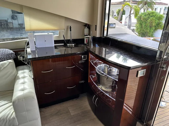 Volk Yacht Photos Pics Luxurious 2009 Lazzara LSX 75 yacht interior with modern kitchen and sleek cabinetry.