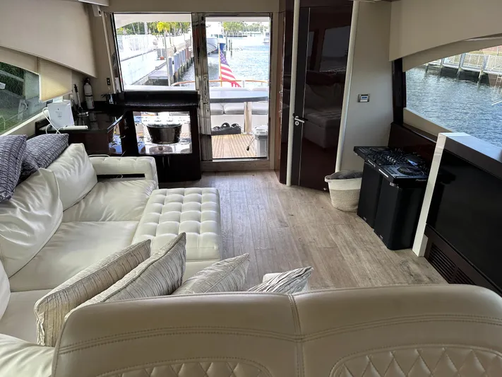 Volk Yacht Photos Pics Luxurious interior of 2009 Lazzara LSX 75 yacht with plush seating and waterfront view.