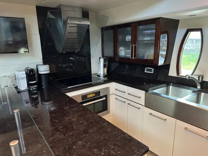 Volk Yacht Photos Pics Luxurious kitchen interior of 2009 Lazzara LSX 75 yacht with modern appliances.