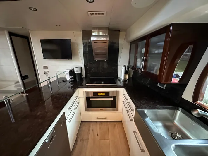 Volk Yacht Photos Pics Luxurious kitchen interior of 2009 Lazzara LSX 75 yacht with modern appliances.