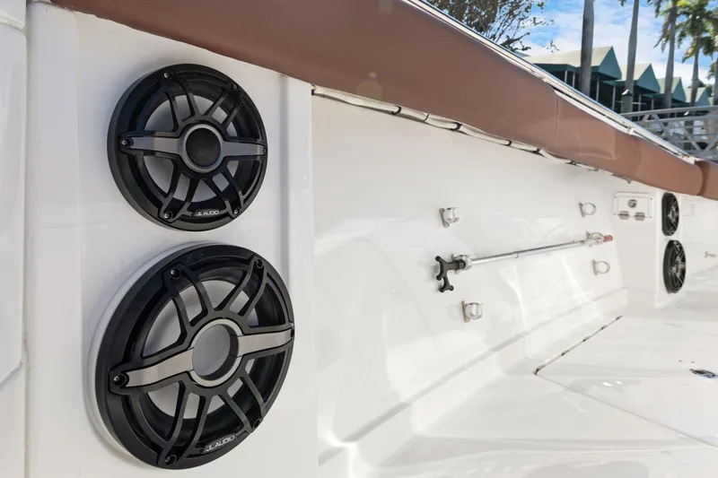  Yacht Photos Pics 2023 HCB Speciale boat with JL Audio speakers on deck, featuring sleek white design.