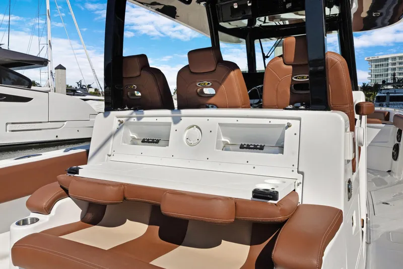  Yacht Photos Pics 2023 HCB Speciale boat interior with brown leather seating and modern console design.