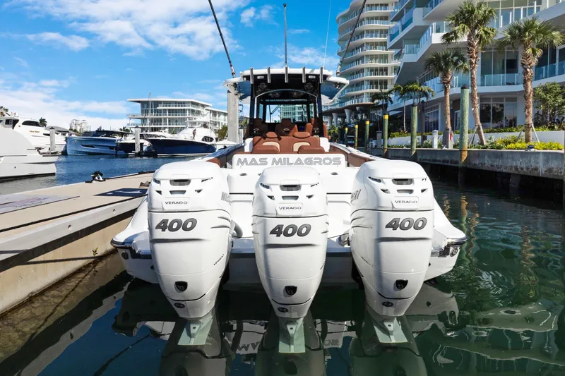  Yacht Photos Pics 2023 HCB Speciale boat with triple Mercury Verado 400 engines docked in a marina.
