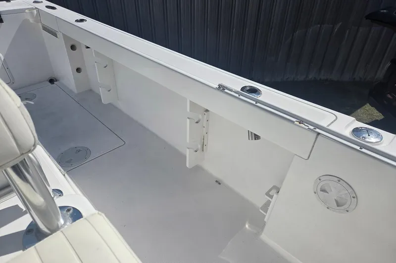 Smooth Operator Yacht Photos Pics 2008 True World Marine TE2810 boat interior with rod holders and seating.