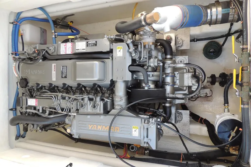 Smooth Operator Yacht Photos Pics Engine compartment of a 2008 True World Marine TE2810 boat, featuring a Yanmar engine.