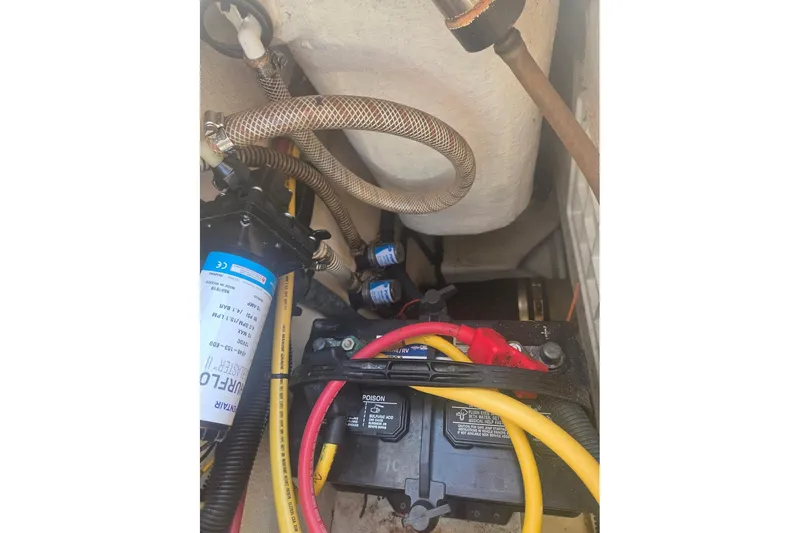 Smooth Operator Yacht Photos Pics 2008 True World Marine TE2810 engine compartment with battery and wiring.