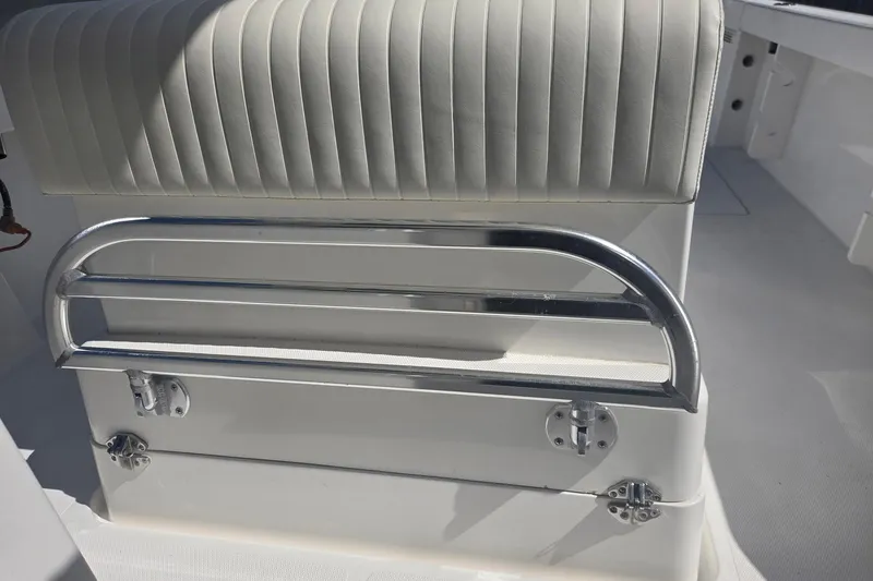 Smooth Operator Yacht Photos Pics 2008 True World Marine TE2810 boat seat with chrome railing and white upholstery.