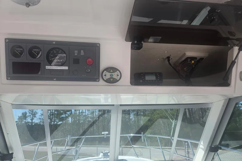 Smooth Operator Yacht Photos Pics 2008 True World Marine TE2810 boat dashboard with gauges and navigation equipment.