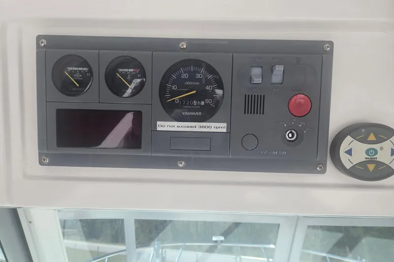 Smooth Operator Yacht Photos Pics 2008 True World Marine TE2810 dashboard with Yanmar engine controls and gauges.