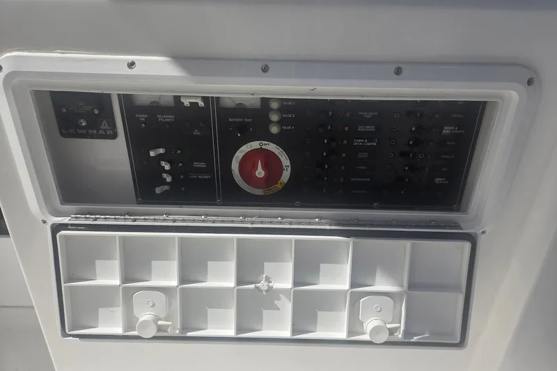 Smooth Operator Yacht Photos Pics Control panel of a 2008 True World Marine TE2810 boat, featuring switches and dials.