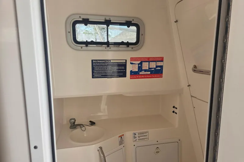 Smooth Operator Yacht Photos Pics 2008 True World Marine TE2810 boat interior with sink and window.