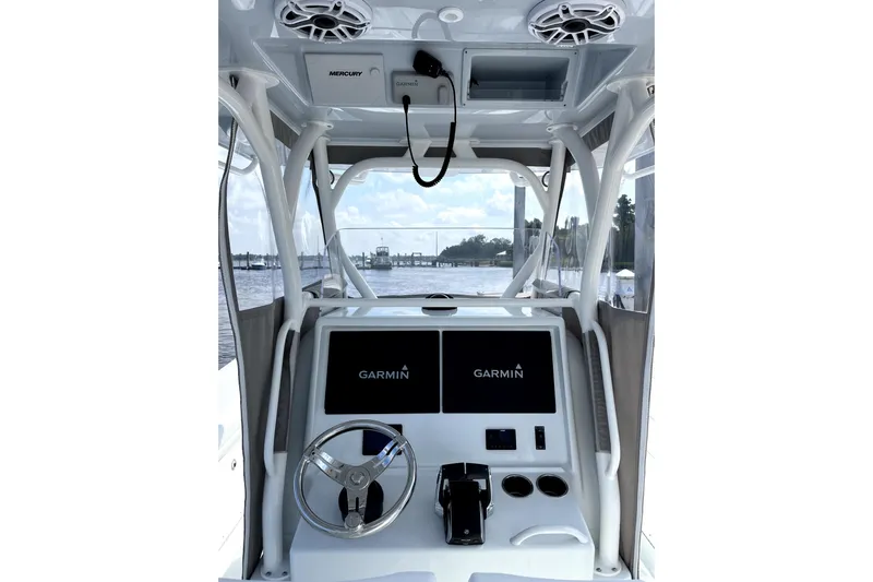 Lunasea Yacht Photos Pics 2023 Yellowfin 32 Offshore boat helm with Garmin displays and Mercury controls.
