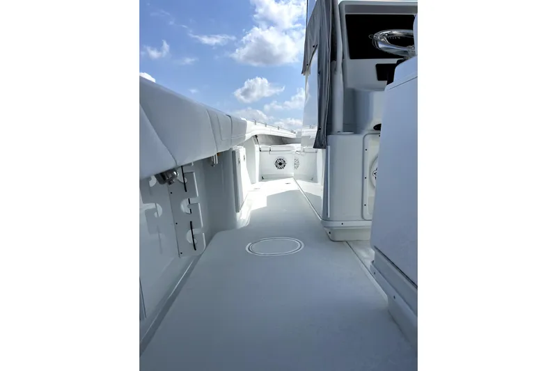 Lunasea Yacht Photos Pics 2023 Yellowfin 32 Offshore boat deck with clear sky background.