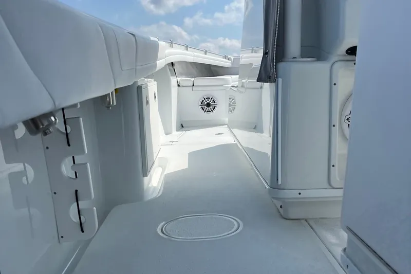 Lunasea Yacht Photos Pics 2023 Yellowfin 32 Offshore boat interior with white seating and modern design.