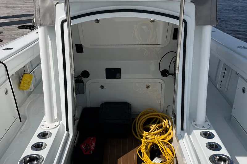 Lunasea Yacht Photos Pics 2023 Yellowfin 32 Offshore boat interior with storage, yellow cable, and accessories.
