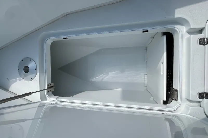 Lunasea Yacht Photos Pics Open storage compartment on 2023 Yellowfin 32 Offshore boat, showcasing spacious interior.