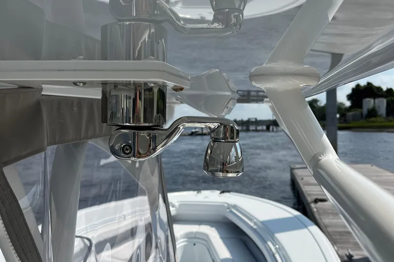 Lunasea Yacht Photos Pics Close-up of 2023 Yellowfin 32 Offshore boat's polished metal fixture with water view.