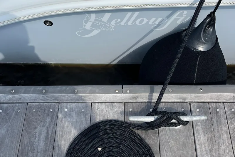 Lunasea Yacht Photos Pics 2023 Yellowfin 32 Offshore boat docked with rope and fender.