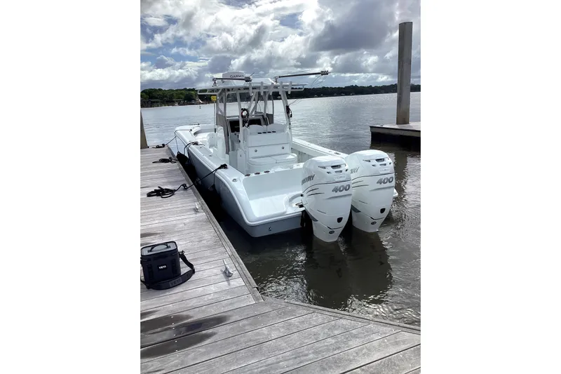 Lunasea Yacht Photos Pics 2023 Yellowfin 32 Offshore boat docked with twin Mercury 400 engines.