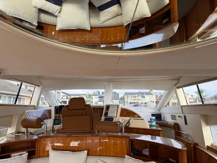 Miss Mazee Yacht Photos Pics Luxurious interior of a 1996 Azimut 54 yacht with plush seating and modern controls.