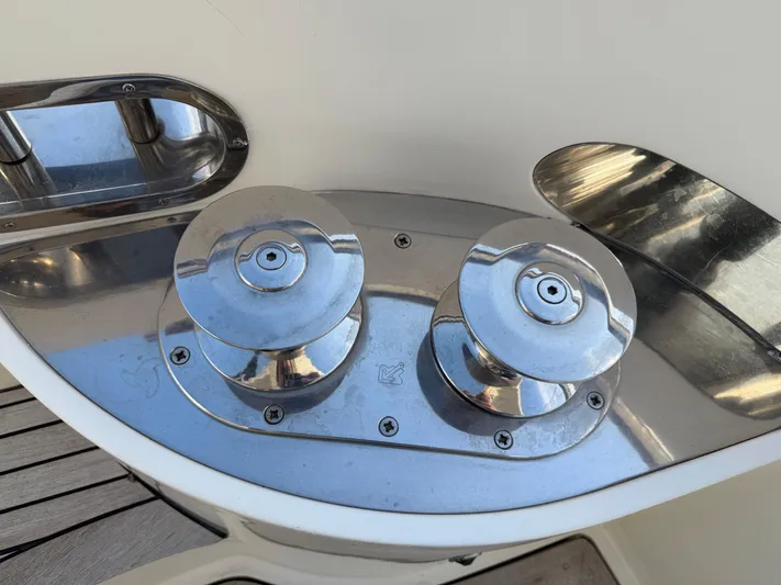 Miss Mazee Yacht Photos Pics Chrome winches on 1996 Azimut 54 yacht deck, reflecting sunlight.