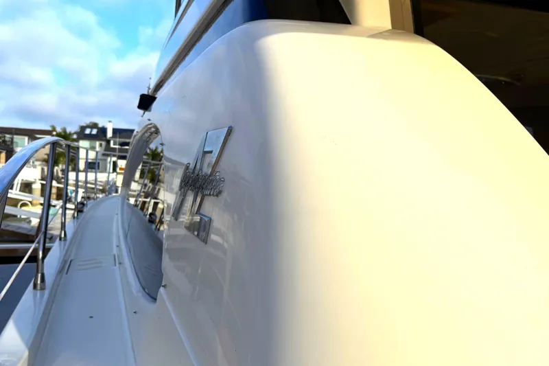 Miss Mazee Yacht Photos Pics 1996 Azimut 54 yacht side view with sleek design and marina background.