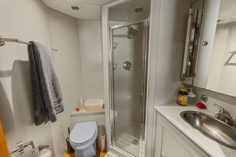  Yacht Photos Pics Bathroom interior of 1999 Trinity Yachts Raised Pilothouse with shower and sink.