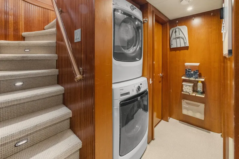  Yacht Photos Pics Laundry area with stacked washer and dryer on 1999 Trinity Yachts Raised Pilothouse.