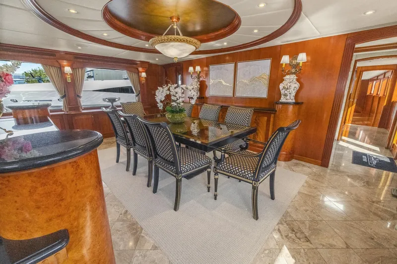  Yacht Photos Pics Luxurious dining area on 1999 Trinity Yachts Raised Pilothouse with elegant decor and seating.