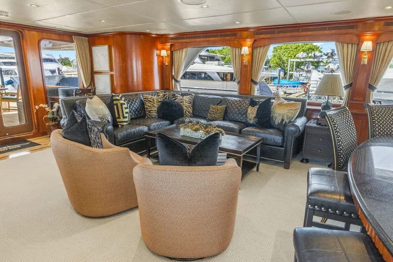  Yacht Photos Pics Luxurious 1999 Trinity Yachts Raised Pilothouse interior with elegant seating and decor.
