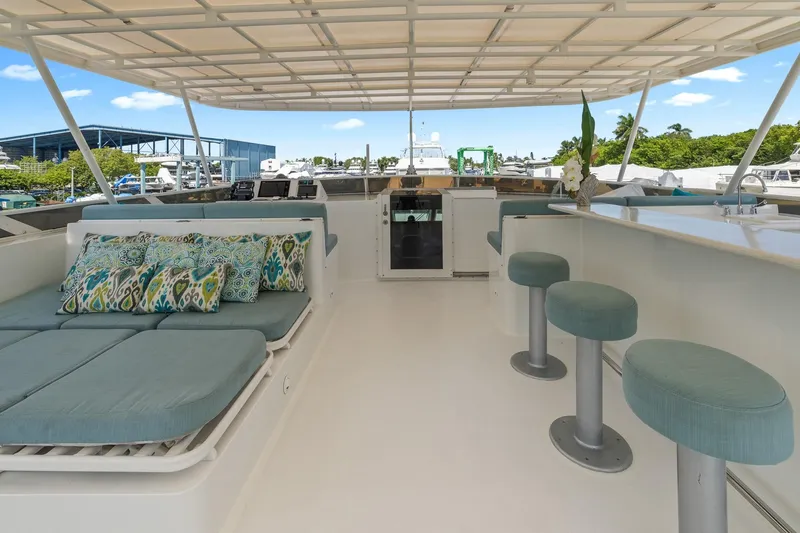  Yacht Photos Pics Luxurious 1999 Trinity Yachts Raised Pilothouse with spacious deck and stylish seating.