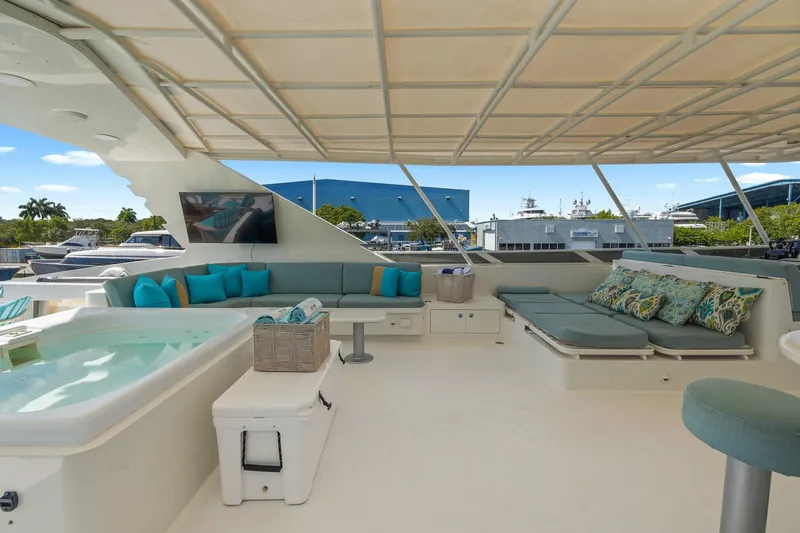  Yacht Photos Pics Luxurious 1999 Trinity Yachts Raised Pilothouse with spacious deck, seating, and jacuzzi.