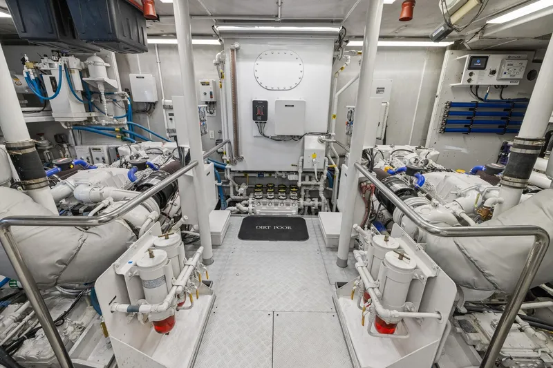  Yacht Photos Pics Engine room of 1999 Trinity Yachts Raised Pilothouse, showcasing machinery and equipment.