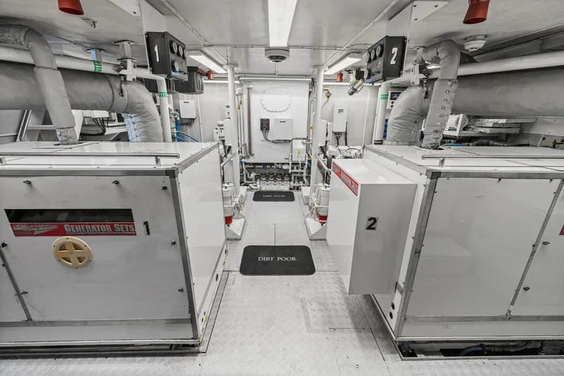  Yacht Photos Pics Engine room of 1999 Trinity Yachts Raised Pilothouse with generator sets and equipment.